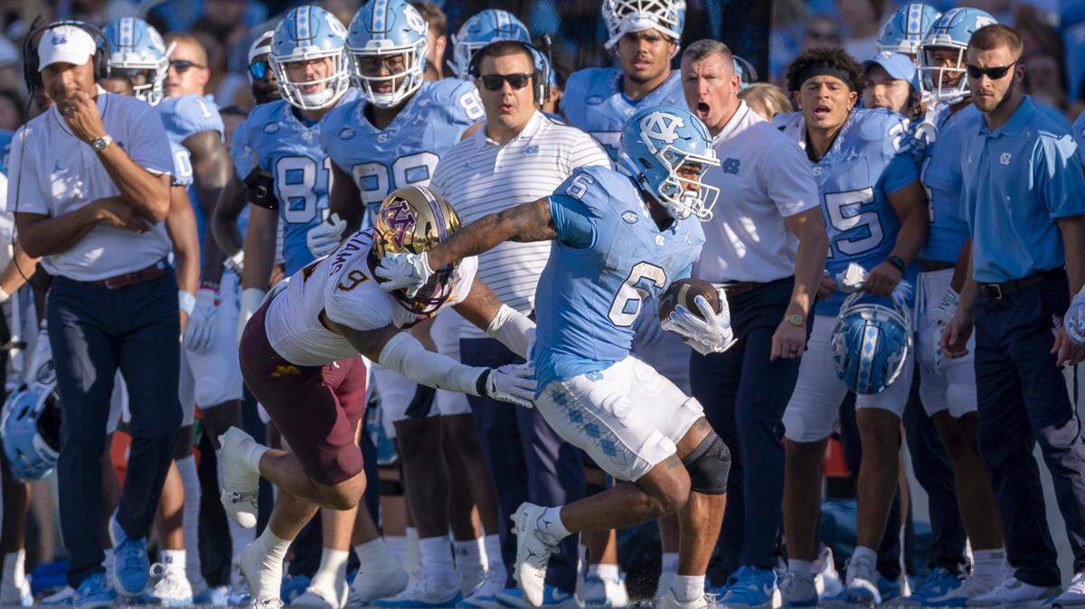 Minnesota’s Devon Williams (9) works to get North Carolina’s Nate McCollum (6) out of bounds after an 11-yard pass reception from quarterback Drake Maye in the third quarter on Saturday, September 16, 2023 at Kenan Stadium in Chapel Hill N.C.