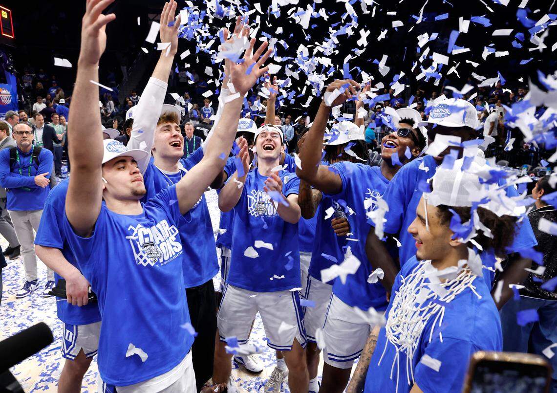 Duke players including Darren Harris, Cooper Flagg, Neal Begovich, Patrick Ngongba II, Khaman Maluach and Tyrese Proctor throw up confetti during the second half of Duke’s 73-62 victory over Louisville in the finals of the 2025 ACC Men’s Basketball Tournament at the Spectrum Center in Charlotte, N.C., Saturday, March 15, 2025.