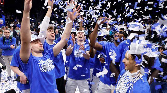 Duke players including Darren Harris, Cooper Flagg, Neal Begovich, Patrick Ngongba II, Khaman Maluach and Tyrese Proctor throw up confetti during the second half of Duke’s 73-62 victory over Louisville in the finals of the 2025 ACC Men’s Basketball Tournament at the Spectrum Center in Charlotte, N.C., Saturday, March 15, 2025.