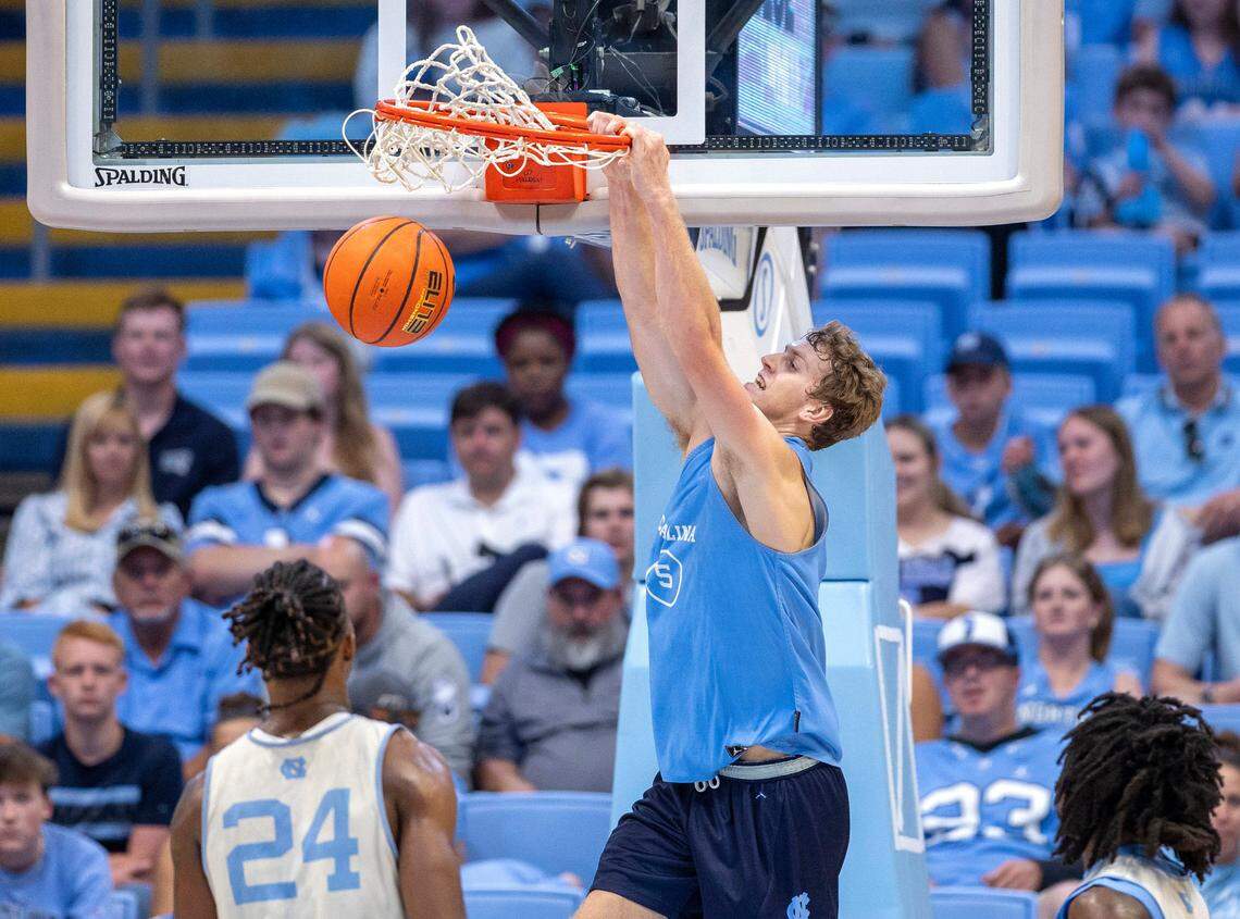 North Carolina’s Cade Tyson (5) gets a dunk over Jae’Lyn Withers (24) in the second half during the Tar Heels’ Blue vs. White scrimmage on Saturday, October 12, 2024 at the Smith Center in Chapel Hill, N.C.