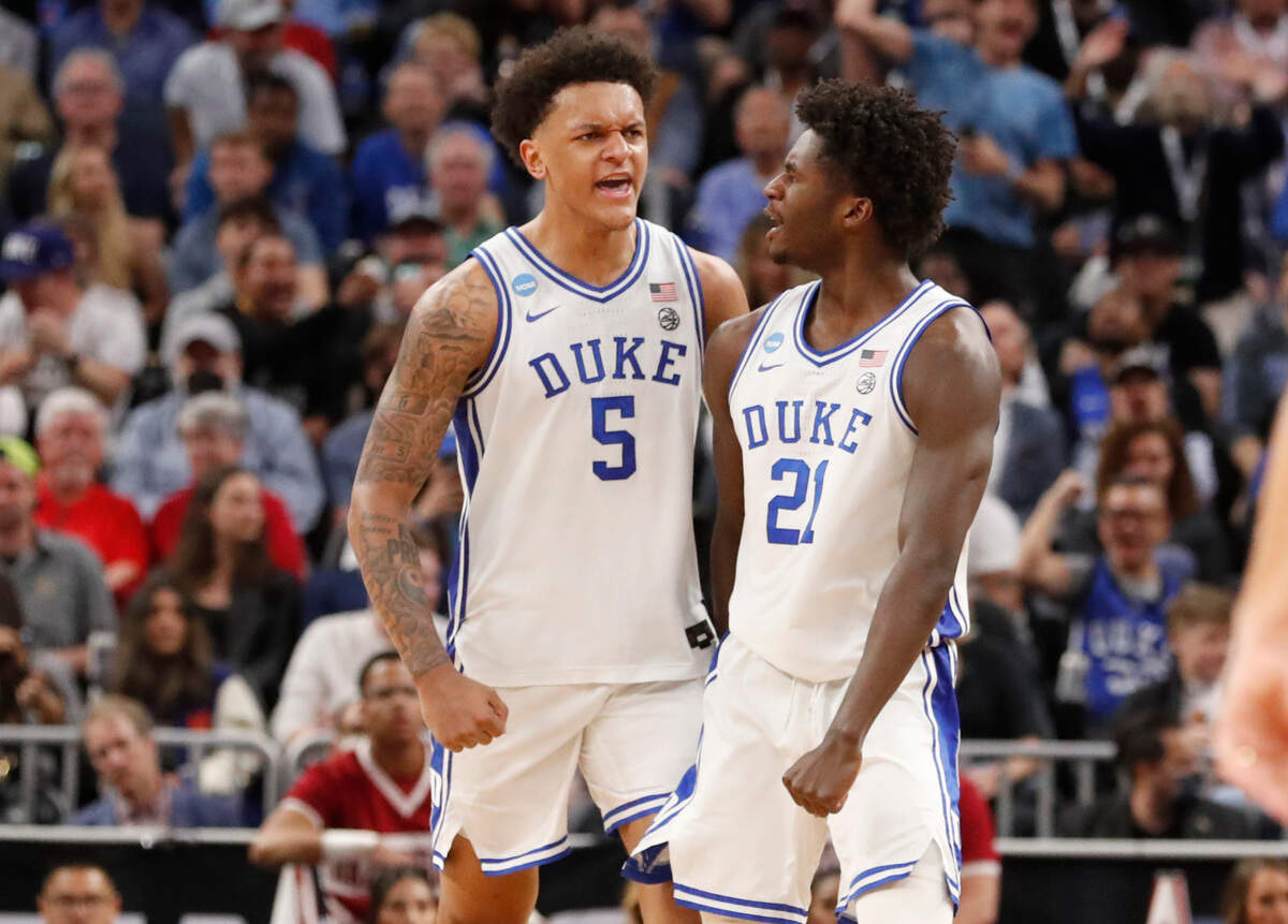 Duke’s Paolo Banchero (5) and AJ Griffin (21) celebrate during the second half of Duke’s 78-69 victory over Arkansas in the NCAA Tournament West Regional finals at the Chase Center in San Francisco, Calif., Saturday, March 26, 2022.