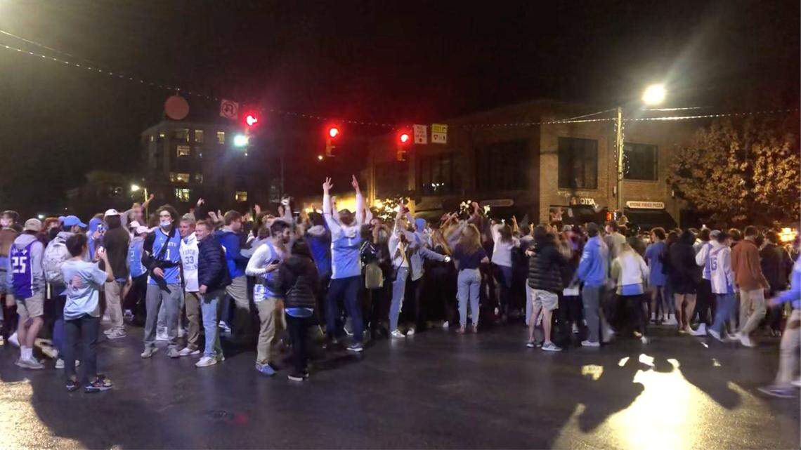 UNC fans celebrate on Franklin Street in Chapel Hill after the Tar Heels defeated Duke Saturday night, Feb. 6, 2021.