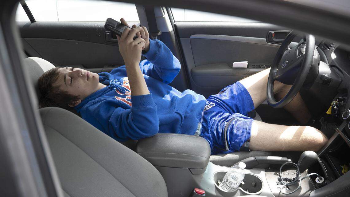 Lance Anthony of Raleigh, waits in his car for his turn to donate blood during an Emergency Blood Drive on Thursday, March 26, 2020 at a the PNC Arena in Raleigh, N.C. The blood drive in the wake of the spread of the COVID-19 virus was sponsored by The Blood Connection, WakeMed and UNC Health. More than 1000 people had signed up online to give. The drive will run until 6 p.m. and walk-ups are welcomed.
