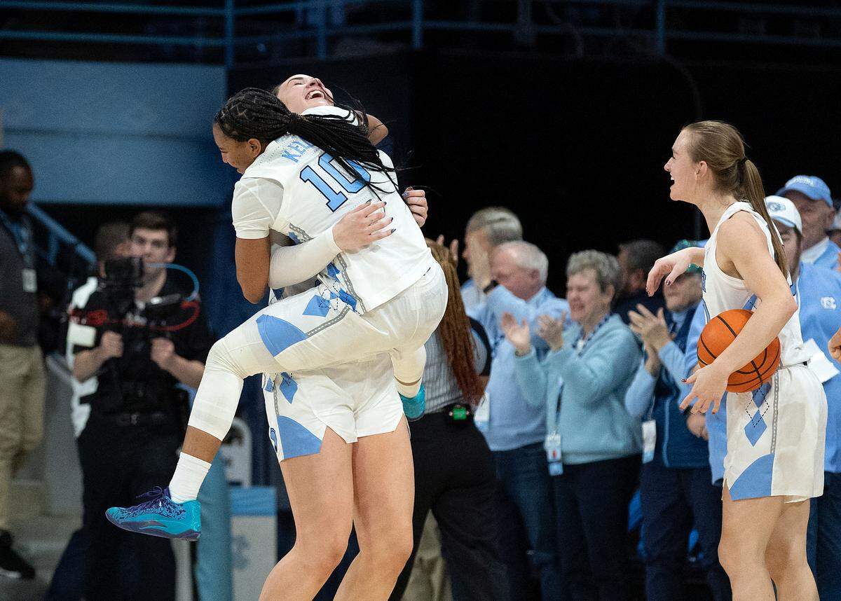 North Carolina’s Reniya Kelly and Blanca Thomas celebrate following the Tar Heels’ 53-46 overtime victory over Duke on Thursday, Jan. 9, 2025, at Carmichael Arena in Chapel Hill, N.C.