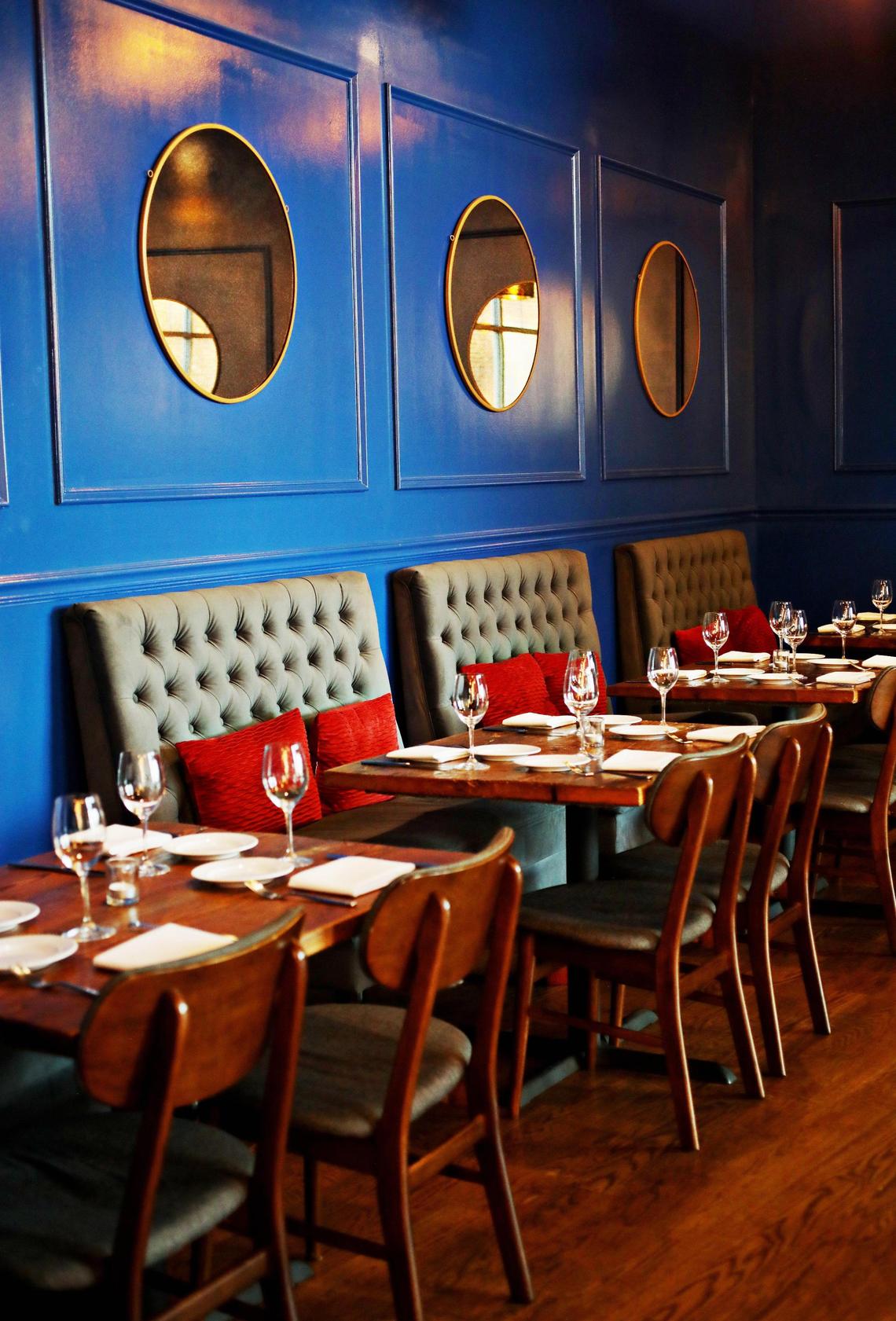 When Oakleaf relocated to Carrboro it changed its decor to a cool sophistication of bold abstract paintings and porthole mirrors on midnight blue walls.