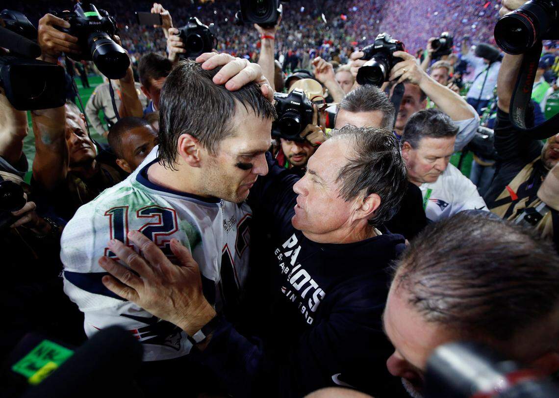 New England Patriots quarterback Tom Brady celebrates with head coach Bill Belichick after defeating the Seattle Seahawks in Super Bowl XLIX at University of Phoenix Stadium in 2015.