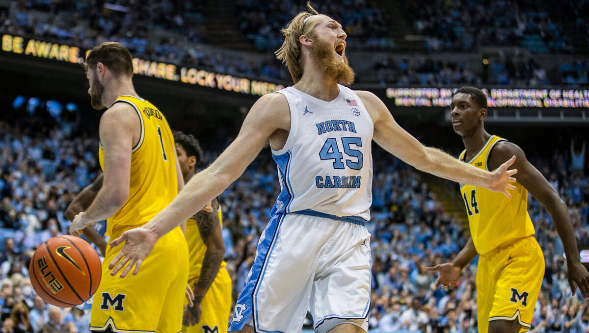 North Carolina’s Brady Manek (45) reacts after a dunk to give the Tar Heels’ an early lead over Michigan during the first half on Wednesday, December 1, 2021 at the Smith Center in Chapel Hill, N.C.