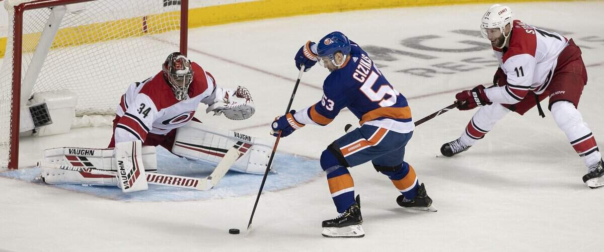 New York Islanders’ Casey Cizikas (53) shoots on Carolina Hurricanes’ goalie Petr Mrazek (34) in the second period during Game 1 of the second round Stanley Cup series on Friday, April 26, 2019 at Barclays Center in Brooklyn, N.Y.