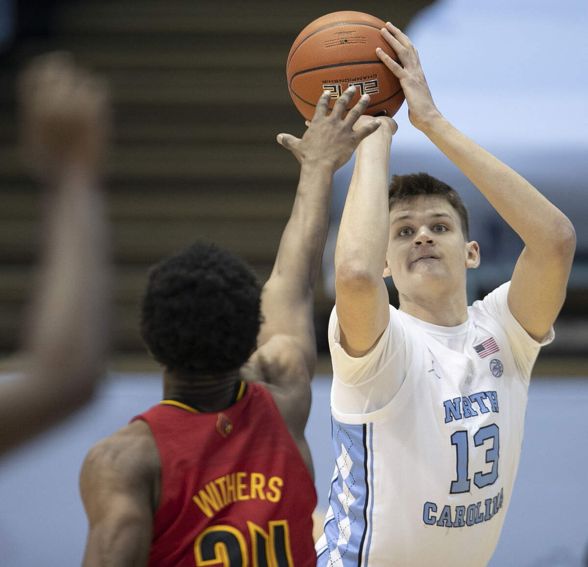 North Carolina’s Walker Kessler (13) take a shot over over Louisville’s Jae’Lyn Withers (24) during the half on Saturday, February 20, 2021 at the Smith Center in Chapel Hill, N.C.