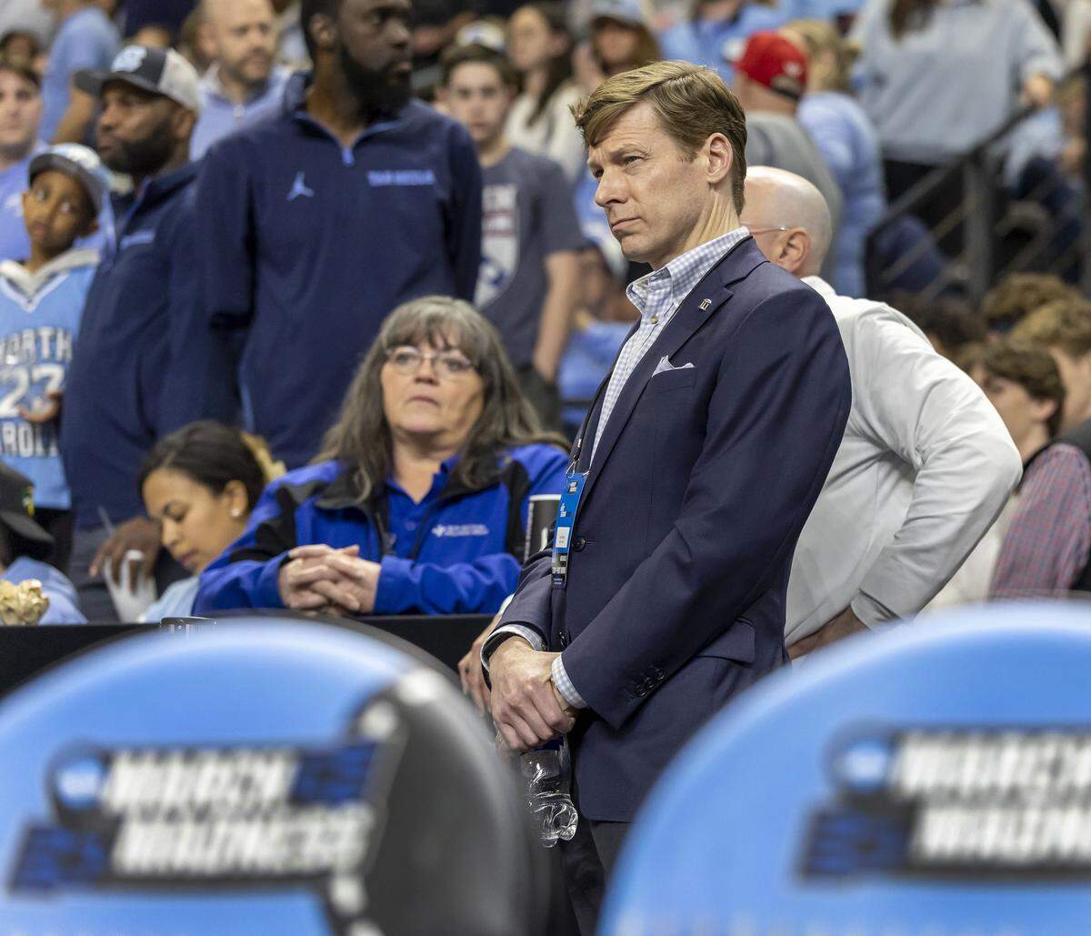 North Carolina Chancellor Lee Roberts watches the overtime period between the Tar Heels and VCU on Thursday, March 18, 2026, during the first round of the NCAA Tournament at Bon Secours Arena in Greenville, S.C.
