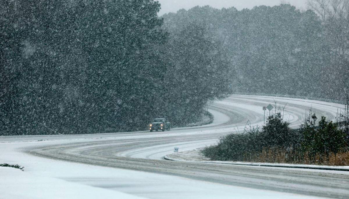 A truck navigates Hammond Road in Raleigh as snow falls in Raleigh Wednesday afternoon, Feb. 19, 2025.