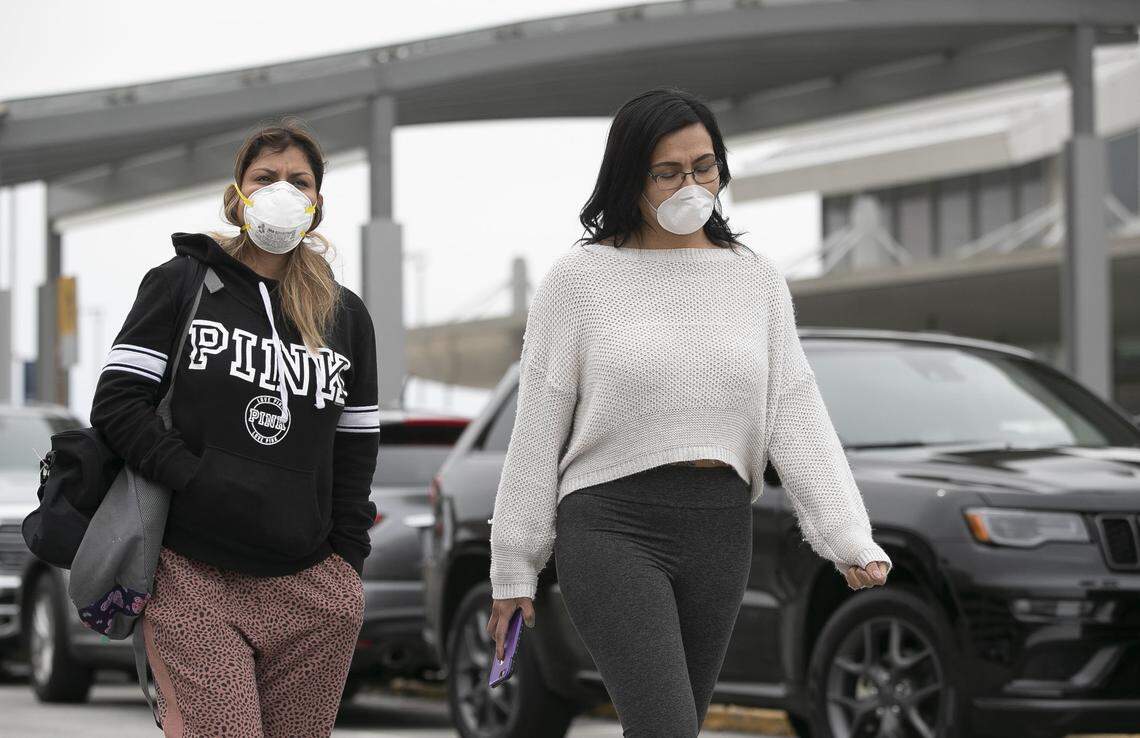 Brenda Cornejo, left, and Margarita Rogan, both of Fayetteville, N.C., wear protective masks as they exit Terminal B on Wednesday, March 4, 2020 at RDU International Airport in Morrisville, N.C. They had just dropped off a friend for an international flight to Peru. Both women said they knew there was a possible case of the COVID-19 virus in Wake County. ‘We heard that you don’t need masks, but we have small children at home and we didn’t want to take any chances”, Cornejo said as she walked to her car.