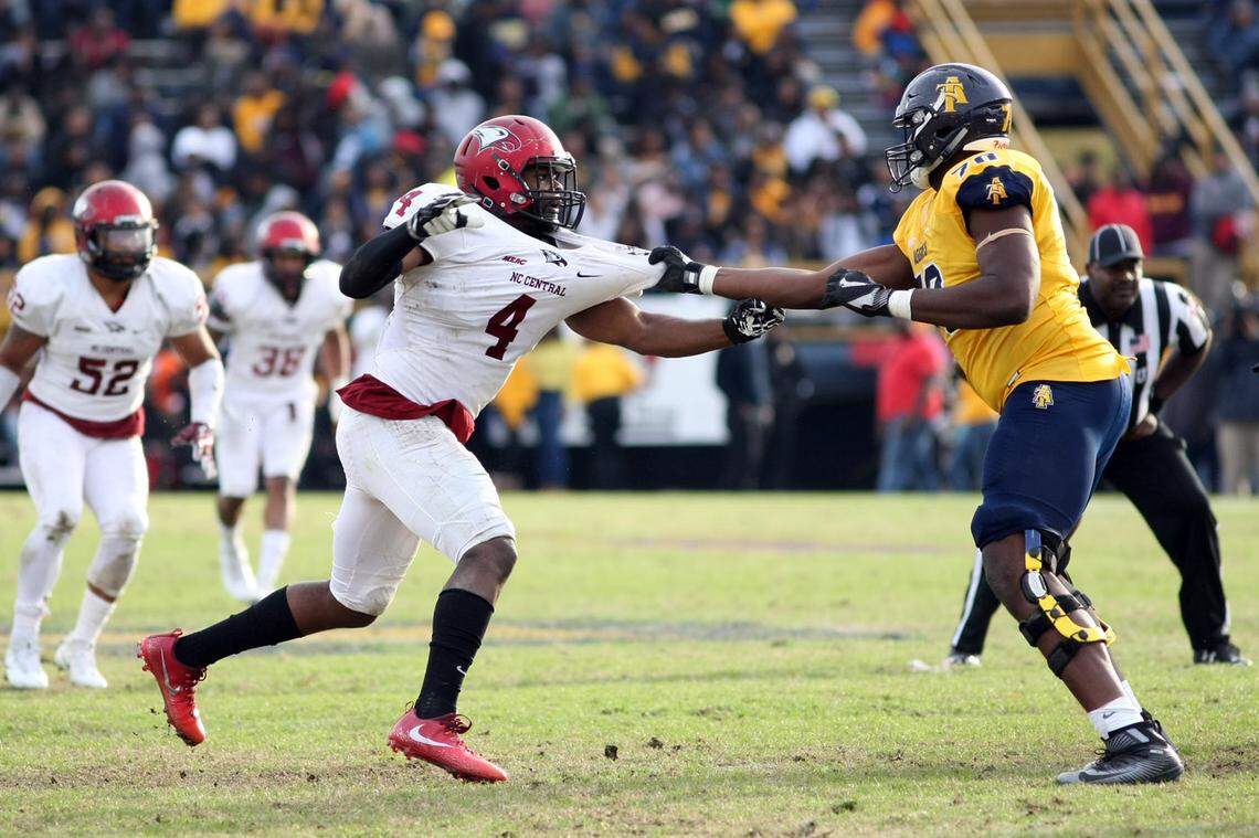 North Carolina Central defensive lineman Randy Anyanwu, left, tries to get around North Carolina A&T offensive lineman Brandon Parker last year in Greensboro. The Aggies and Eagles will meet for the 90th time this Saturday in Durham.