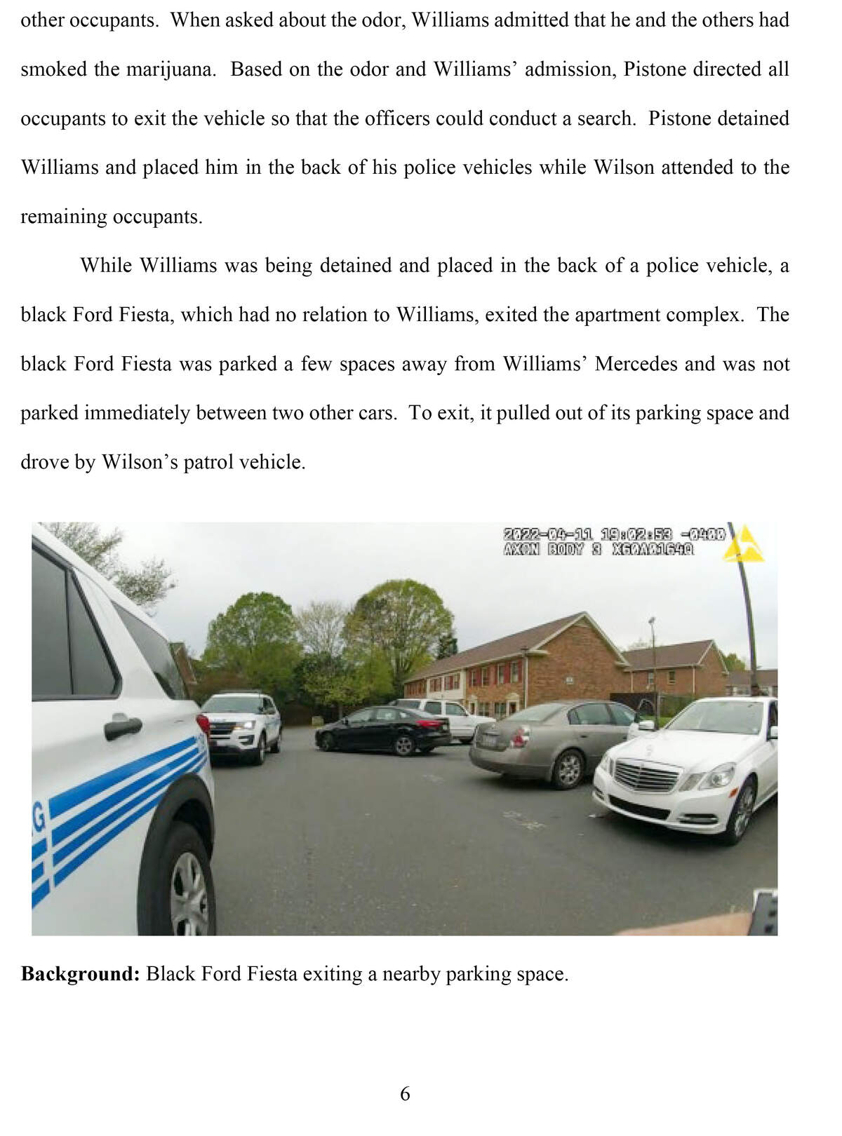 A screenshot from police video show a Charlotte-Mecklenburg police SUVs parked in the middle of the street, partially blocking Kevin Williams’ white Mercedes.