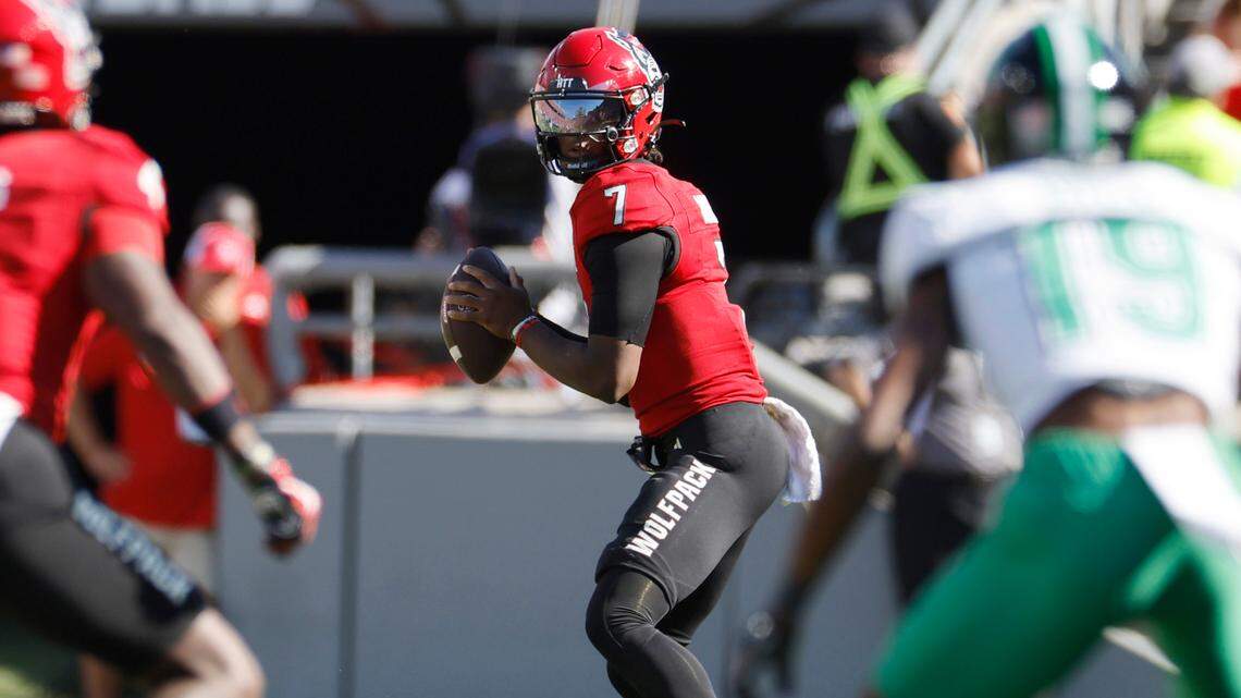 N.C. State quarterback MJ Morris (7) looks for a receiver downfield during the first half of N.C. State’s game against Marshall at Carter-Finley Stadium in Raleigh, N.C., Saturday, Oct. 7, 2023.