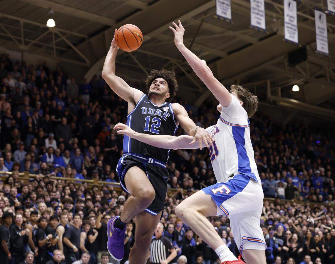 Duke’s Cameron Boozer drives to the basket past Florida's Alex Condon during the second half of the Blue Devils’ 67-66 win in the ACC/SEC Challenge on Tuesday, Dec. 2, 2025 at Cameron Indoor Stadium in Durham, N.C.