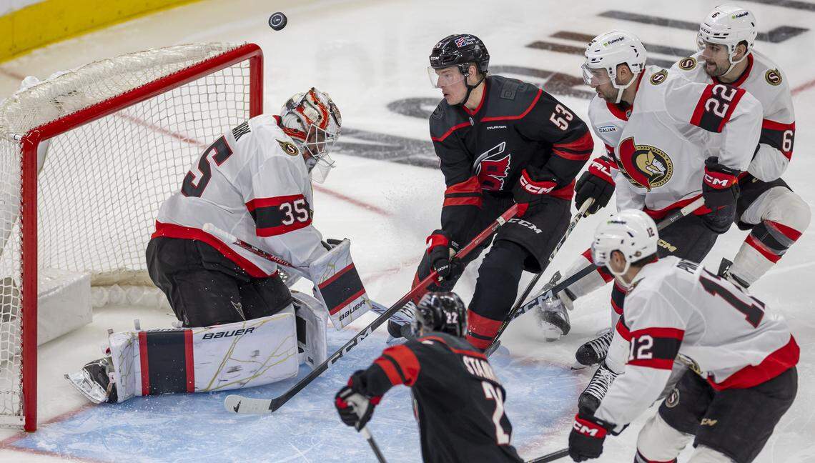 Ottawa Senators goalie Liunus Ullmark (left) deflects a shot by Carolina Hurricanes right wing Jackson Blake in the third period on Saturday, April 18, 2026 during the first round of the Stanley Cup Playoffs at Lenovo Center in Raleigh, N.C.