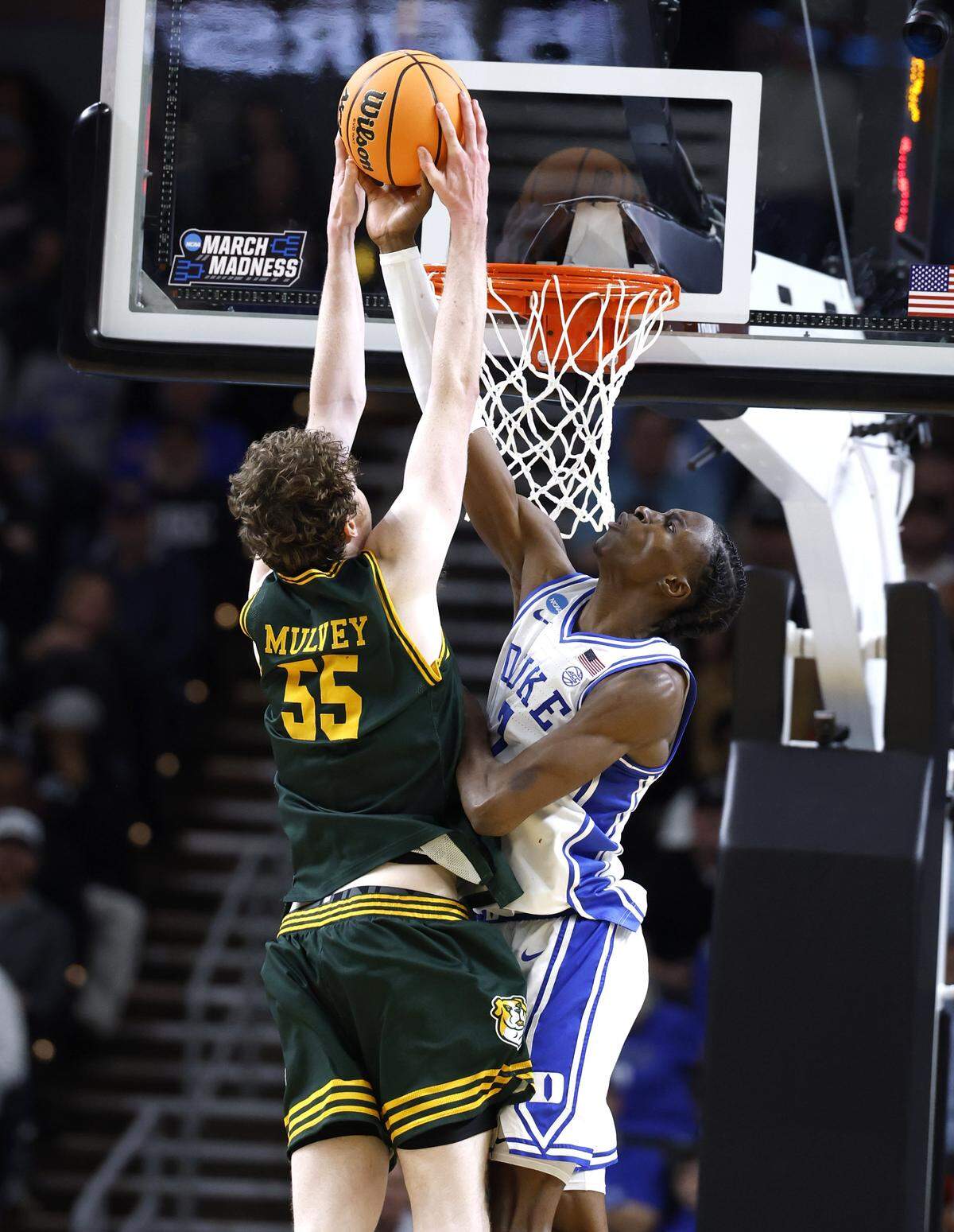 Duke’s Dame Sarr (7) blocks the shot by Siena’s Riley Mulvey (55) in the second half of Duke’s 71-65 victory over Siena in the first round of the NCAA Men’s Basketball Tournament at  Bon Secours Wellness Arena in Greenville, S.C., Thursday, March 19, 2026.