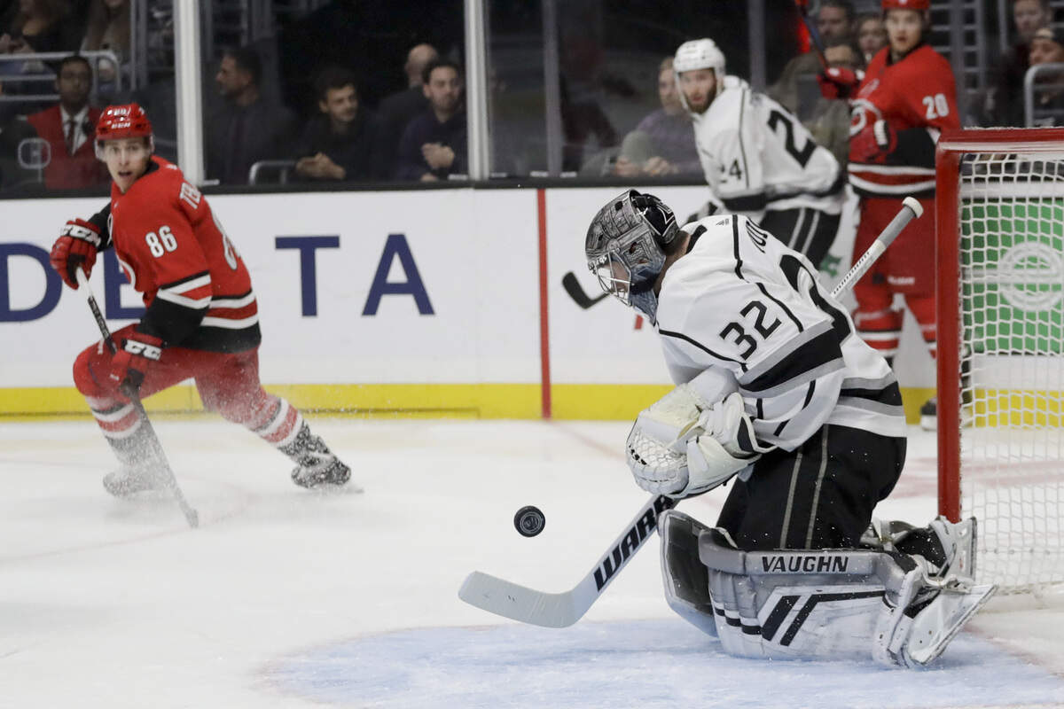 Los Angeles Kings goaltender Jonathan Quick makes a save against the Carolina Hurricanes during the first period of an NHL hockey game in Los Angeles, Sunday, Dec. 2, 2018. (AP Photo/Chris Carlson)