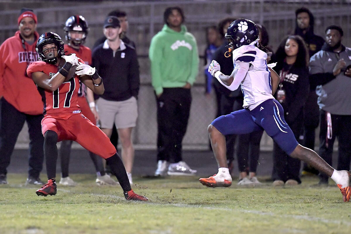 Rolesville wide receiver Jaedon Alford (17) makes the catch ahead of Millbrook’s Nessiah McArthur (6) during the first half. The Rolesville Rams and the Millbrook Wildcats met in a football game in Raleigh. N.C. on October 11, 2024.