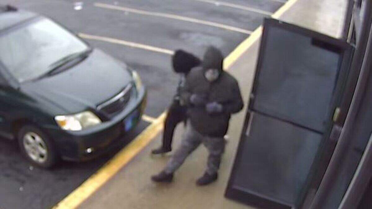 Security photo of two men suspected in the shooting death of an employee during an armed robbery of a gaming center in Asheboro on Nov. 11.