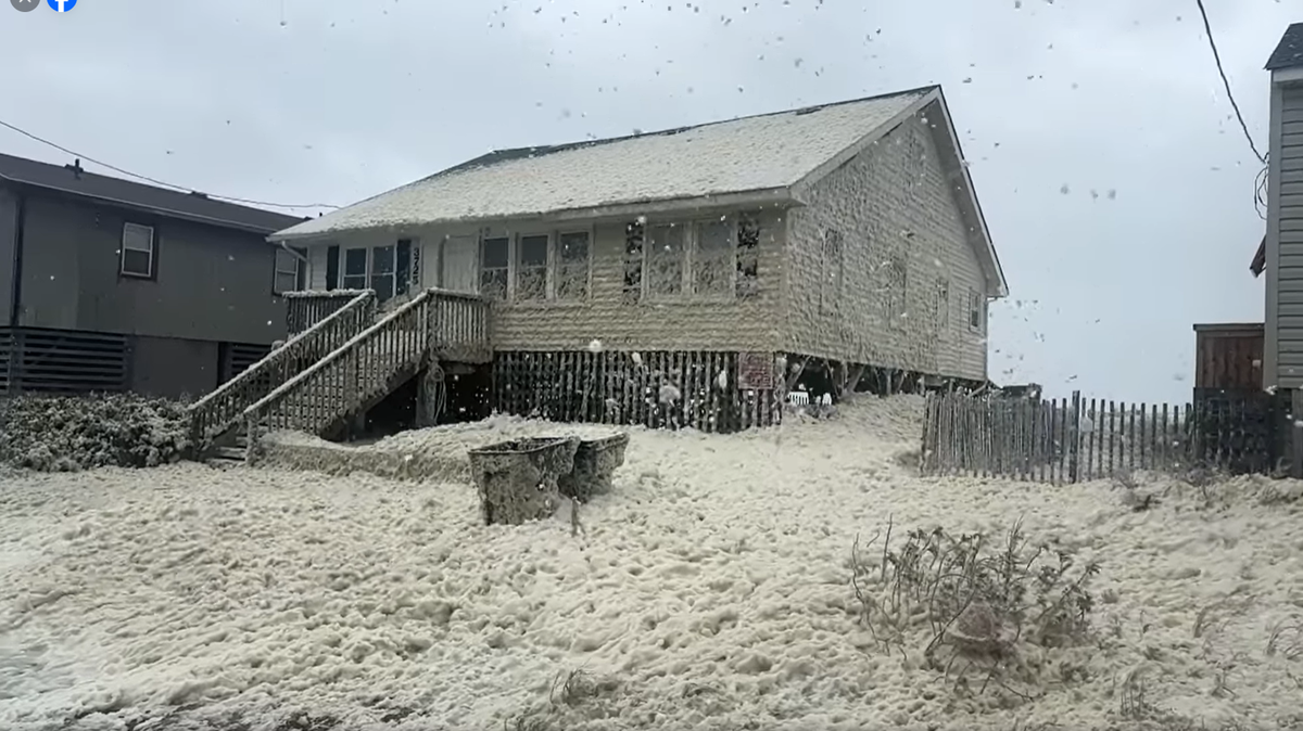 A substance resembling snow became crawling out of the Atlantic Ocean in Kitty Hawk on North Carolina’s Outer Banks, video shows.