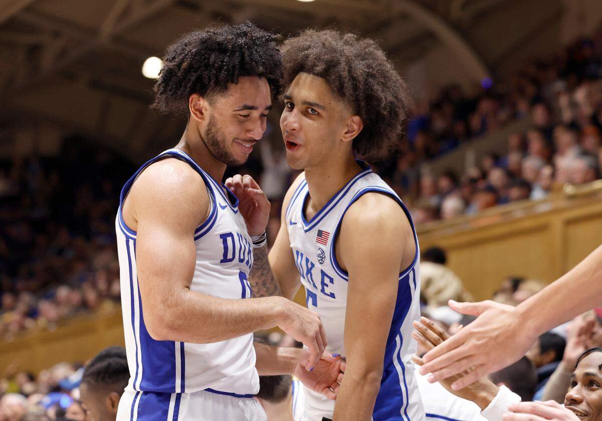Duke’s Tyrese Proctor (5), right, talks with Jared McCain (0) as he comes off the court during the second half of Duke’s 90-60 victory over Bucknell at Cameron Indoor Stadium in Durham, N.C., Friday, Nov. 17, 2023.