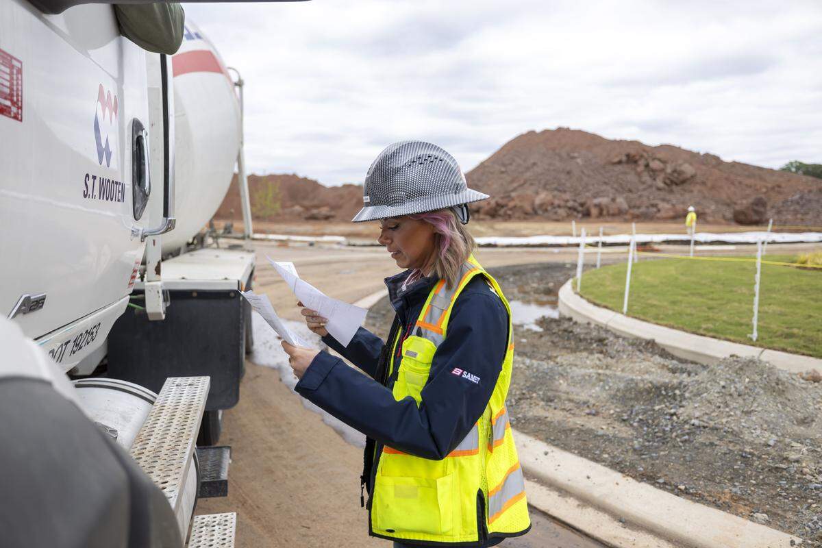 Construction project manager Sam Roth, directs a delivery of concrete at the Veridea mixed-use development site on Tuesday, April 28, 2026 in Apex, N.C. 