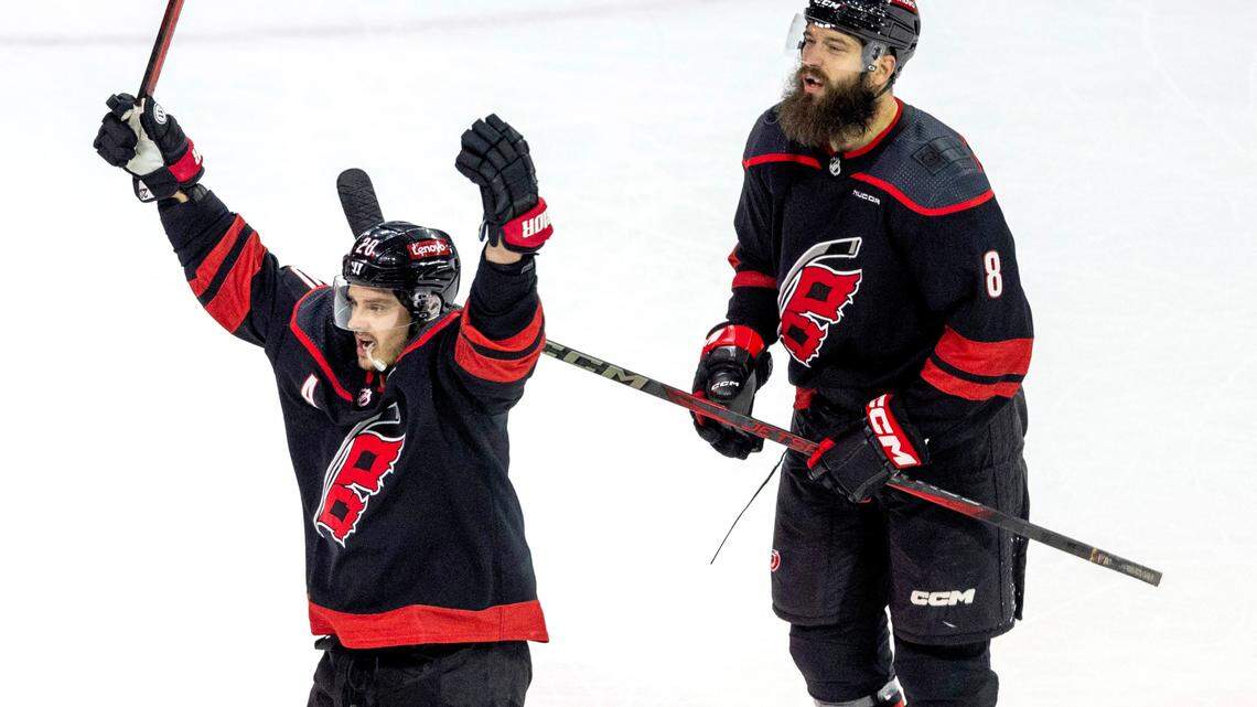 Carolina Hurricanes center Sebastian Aho (20) reacts after a goal by Andrei Svechnikov during their game against the New York Rangers in the second round of the 2024 Stanley Cup playoffs on Thursday, May 9, 2024 at PNC Arena, in Raleigh N.C. With Aho is Brent Burns (8).