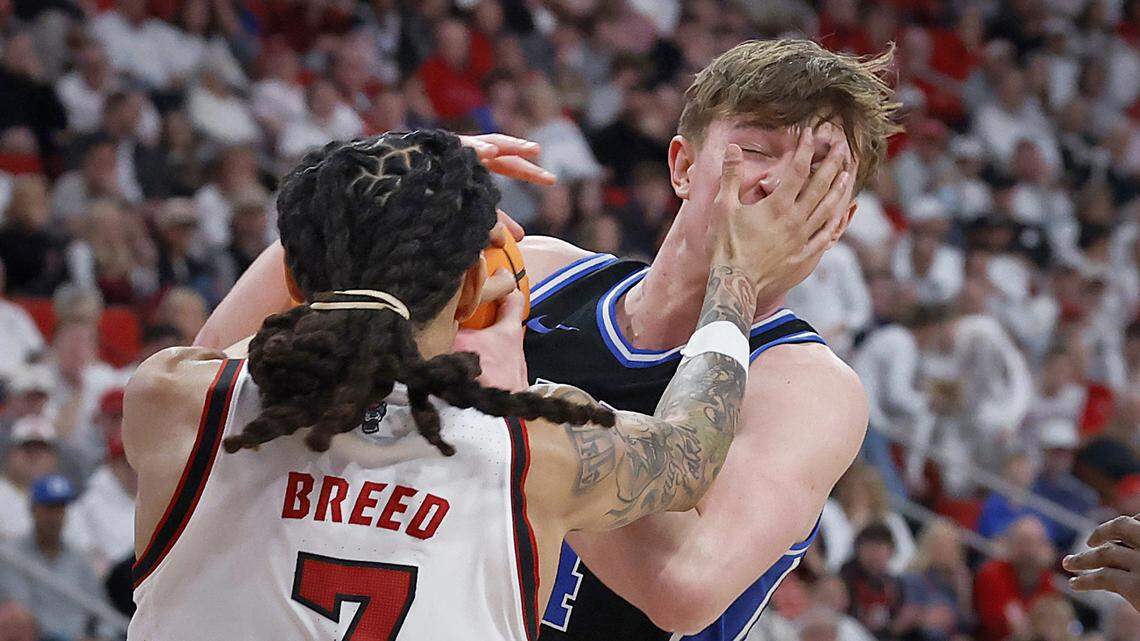 NC State's Alyn Breed pressures Duke’s Nikolas Khamenia during the first half of the Blue Devils’ game on Monday, March 2, 2026, at Lenovo Center in Raleigh, N.C. 