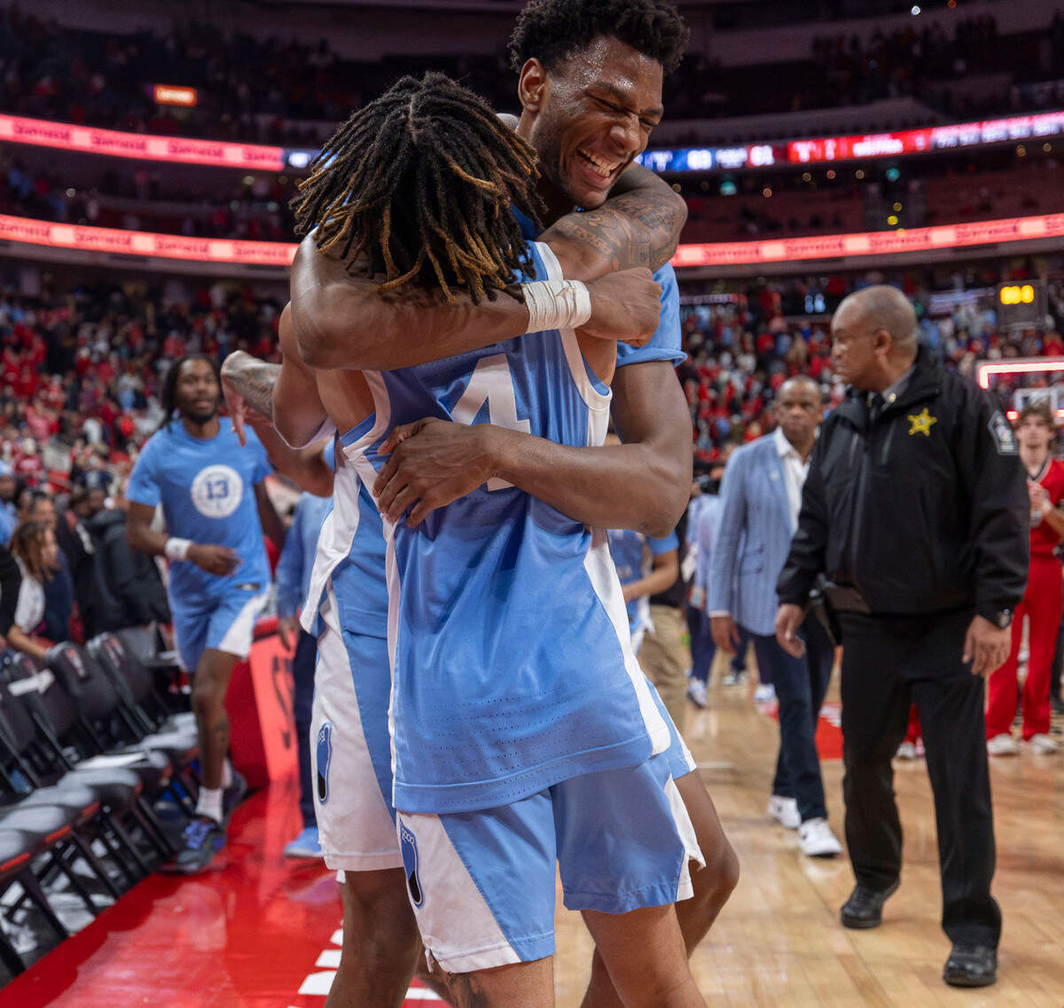 North Carolina guard R.J. Davis (4) embraces teammate Jalen Washington (13), after his blocked shot secured the Tar Heels’ 63-61 victory over N.C. State on Saturday, January 11, 2025 at Lenovo Center in Raleigh, N.C.