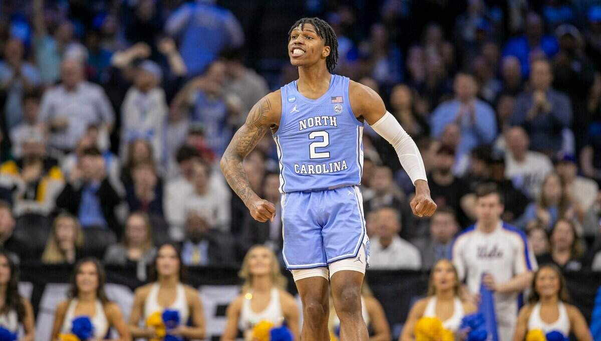 North Carolina’s Caleb Love (2) reacts after a three-point basket in the second half against UCLA on Friday, March 25, 2022 during the NCAA East Regional semi-final at Wells Fargo Center in Philadelphia, Pa. Love lead the Tar Heels with 30 points in their 73-66 victory.