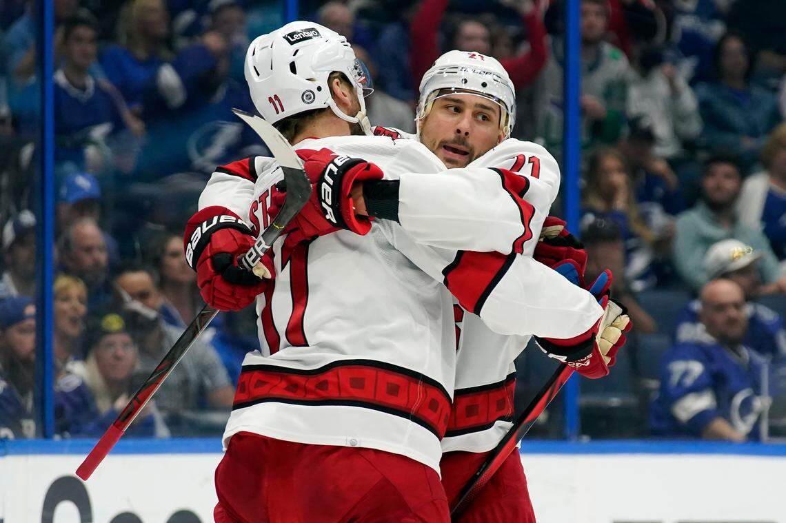 Carolina Hurricanes right wing Nino Niederreiter (21) celebrates with center Jordan Staal (11) after scoring against the Tampa Bay Lightning during the first period of an NHL hockey game Tuesday, March 29, 2022, in Tampa, Fla. (AP Photo/Chris O’Meara)