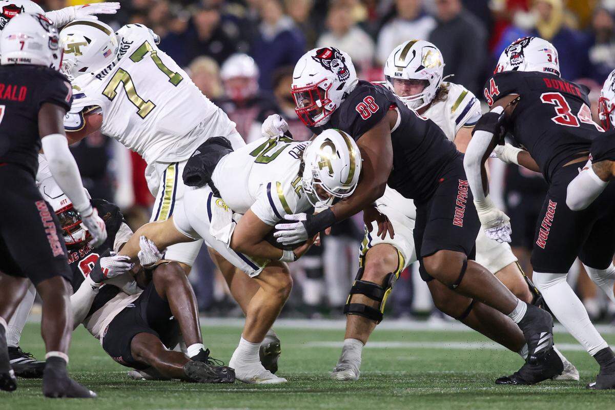 North Carolina State Wolfpack defensive end Isaiah Shirley (88) tackles Georgia Tech Yellow Jackets quarterback Aaron Philo (12) in the second quarter at Bobby Dodd Stadium at Hyundai Field.
