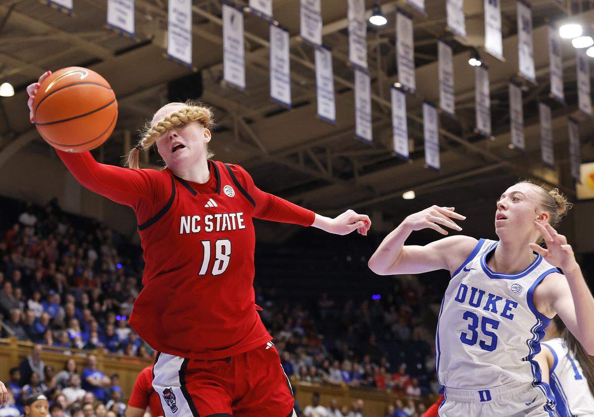 N.C. State’s Tilda Trygger corrals a rebound away from Duke’s Toby Fournier during the first half of the Wolfpack’s 83-65 loss on Thursday, Feb. 19, 2026, at Cameron Indoor Stadium in Durham, N.C. 