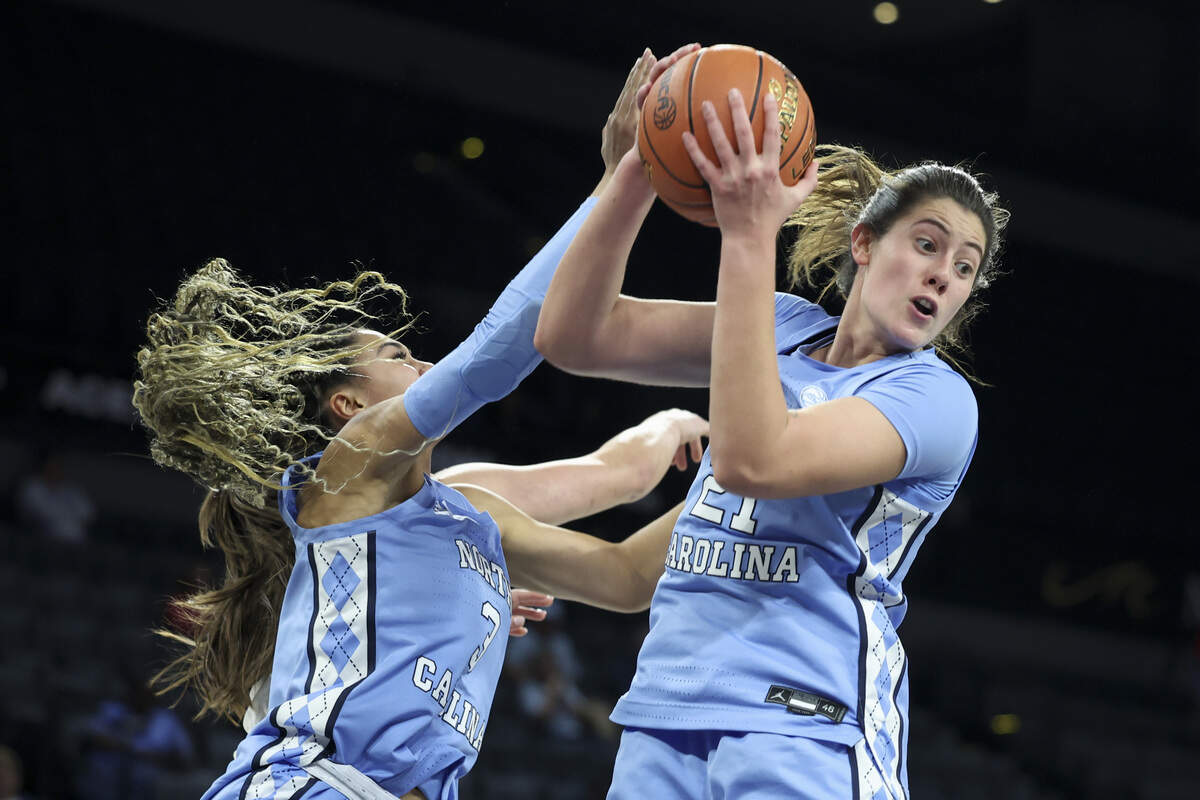 Taliyah Henderson, left, and Ciera Toomey of the North Carolina Tar Heels contest for a rebound in the fourth quarter of a 2025 WBCA Challenge game against the UCLA Bruins at Michelob ULTRA Arena on Nov. 13, 2025 in Las Vegas, Nevada.