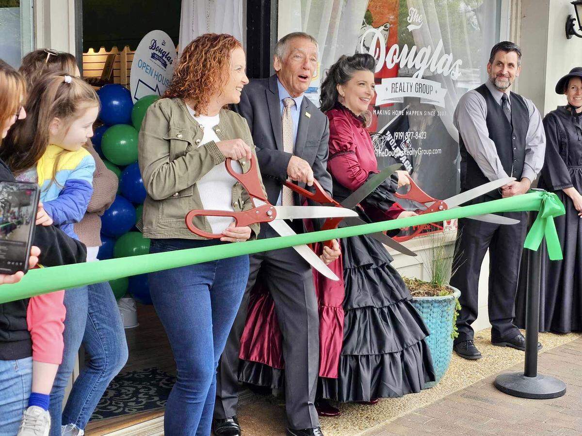 On April 5, 2024, Cary’s Mayor Harold Weinbrecht joined Katherine Loflin of The City Doctor Productions and Leslie Douglas of the Douglas Realty Group for a ribbon cutting to officially open the Cary Visitor Center.