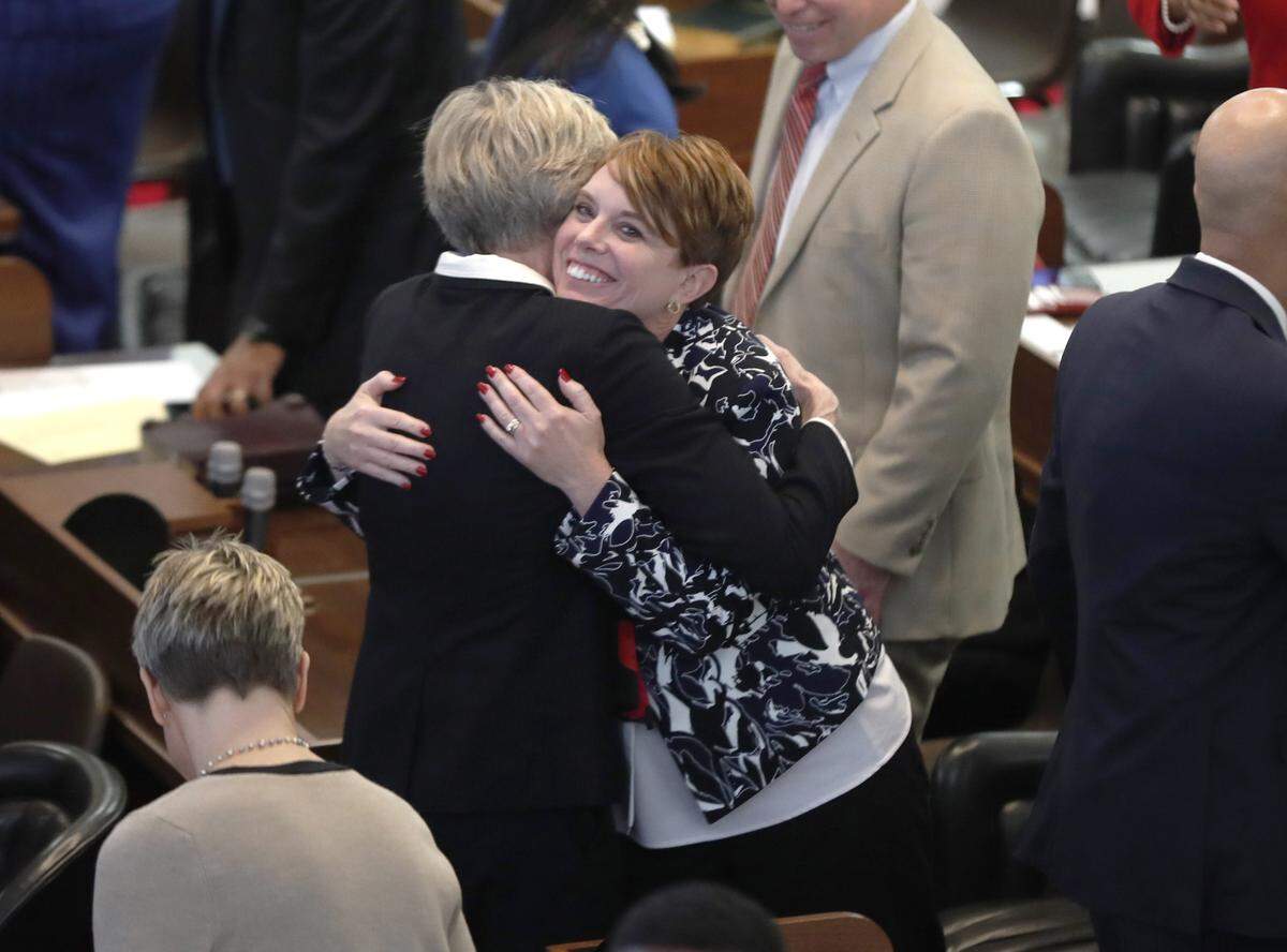 Rep. Marcia Morey, left, hugs Rep. Julie von Haefen as the N.C. General Assembly convenes in Raleigh, N.C., Wednesday, January 9, 2019.