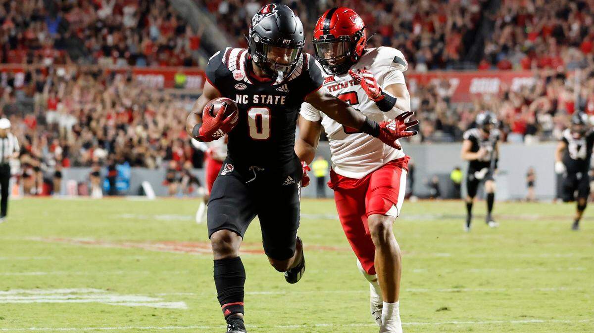 N.C. States Demie Sumo-Karngbaye (0) beats Texas Tech defensive back Kosi Eldridge (6) to score on a 38-yard touchdown reception from Thayer Thomas during the second half of N.C. States 27-14 victory over Texas Tech at Carter-Finley Stadium in Raleigh, N.C., Saturday, Sept. 17, 2022.