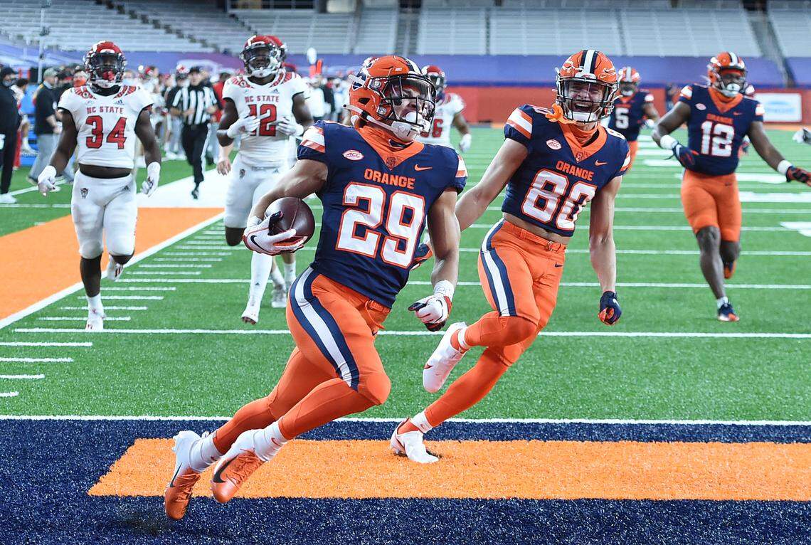 Syracuse Orange wide receiver Trebor Pena (29) runs back a kickoff for a touchdown during a game against North Carolina State on Saturday, Nov. 28, 2020, at the Carrier Dome in Syracuse, N.Y.