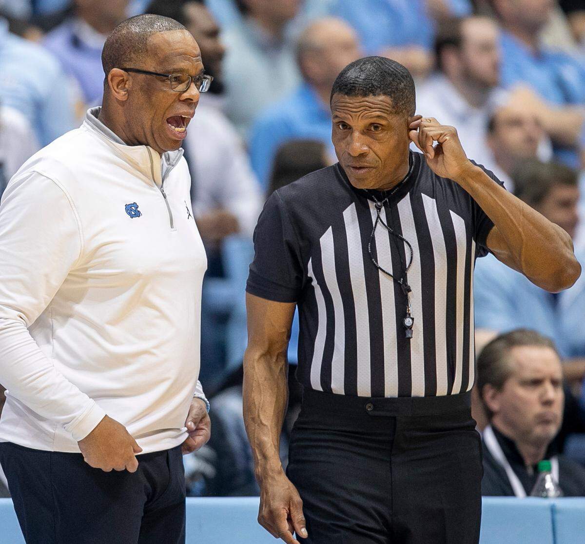 North Carolina coach Hubert Davis has a word with official Ted Valentine in the second half against Clemson on Saturday, February 11, 2023 at the Smith Center in Chapel Hill, N.C.