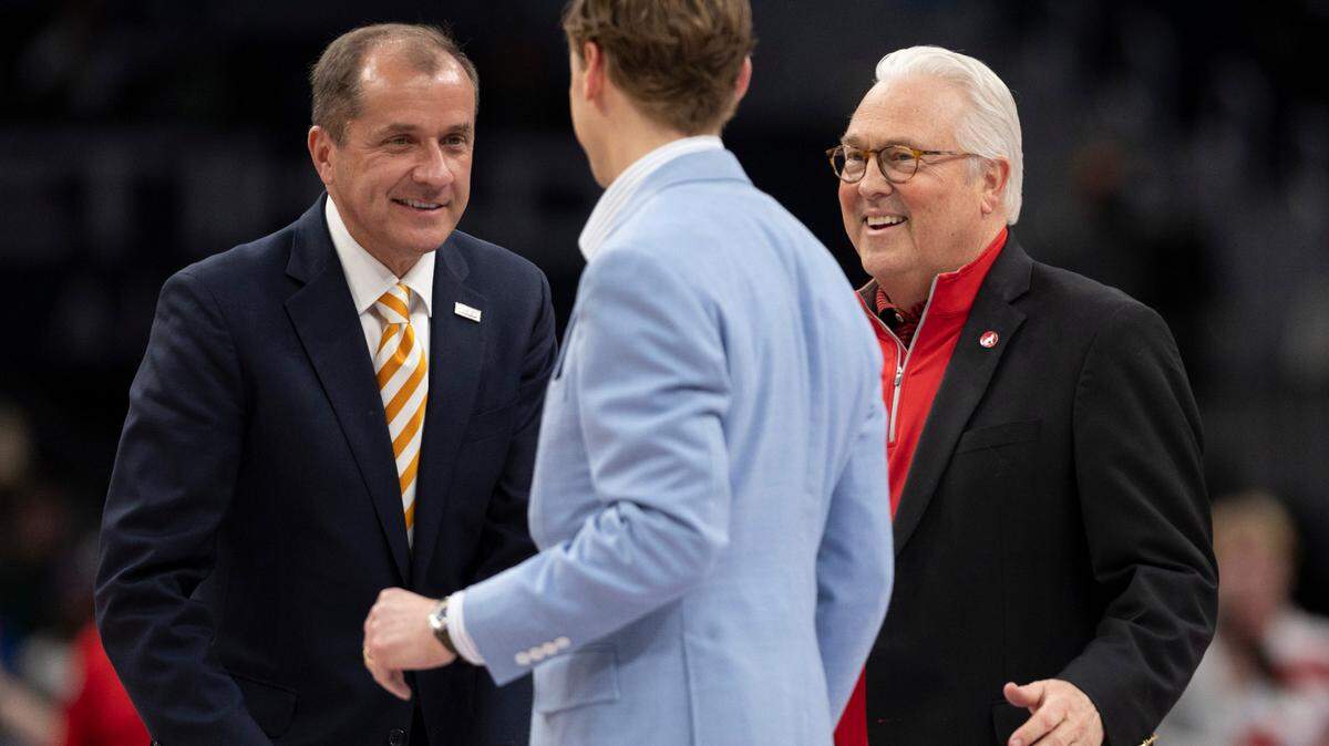 ACC Commissioner Jim Phillips talks with interim UNC chancellor Lee Roberts and N.C. State chancellor Randy Woodson during the ACC Men’s Basketball Tournament Championship at Capitol One Arena on Saturday, March 16, 2024 in Washington, D.C.