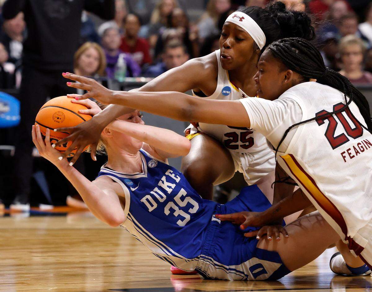 South Carolina’s Raven Johnson and Sania Feagin pressure Duke’s Toby Fournier during the first half of the Blue Devils’ NCAA Tournament Elite Eight matchup at Legacy Arena on Sunday, March 30, 2025, in Birmingham, Ala.