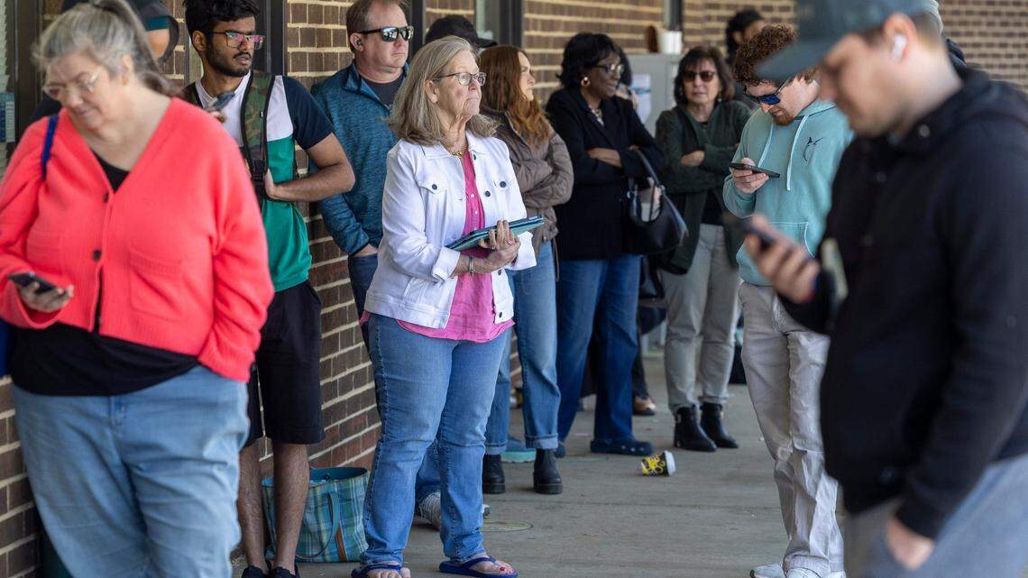 Shelley Holmes, center, waits in line with 40 other customers at the North Carolina DMV Driver’s License Office on Avent Ferry Road on April 10, 2025, in Raleigh. Most arrived well before 9 a.m. seeking a spot in the “first come, first served” line.