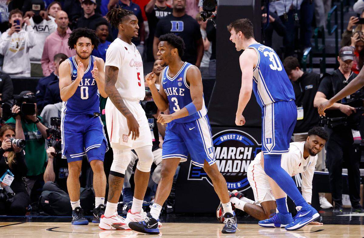 Duke’s Jared McCain (0), Jeremy Roach (3) and Kyle Filipowski (30) celebrate after a Houston turnover late in the second half of Duke’s 54-51 victory over Houston in their NCAA Tournament Sweet 16 game at the American Airlines Center in Dallas, Texas, Friday, March 29, 2024.