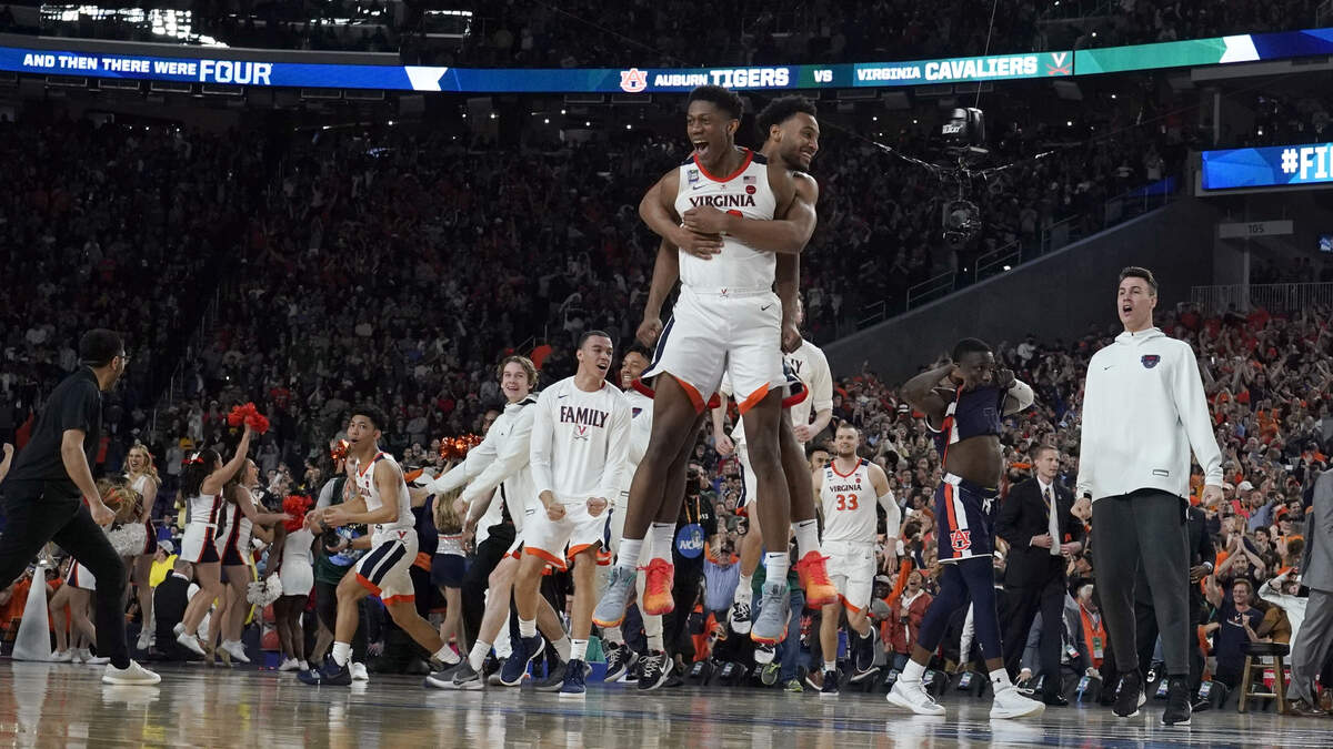 Virginia players celebrate after defeating Auburn 63-62 in the Final Four, Saturday, April 6, 2019, in Minneapolis.