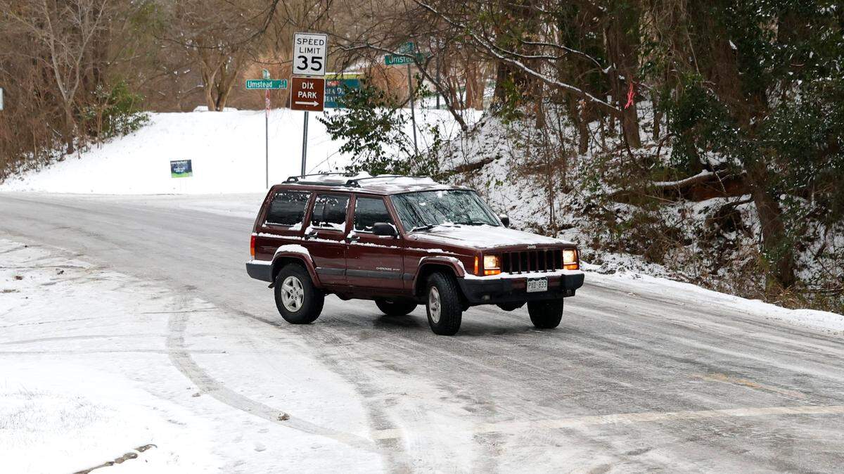 Thursday update: NC roads covered with snow and ice. People urged to stay home.
