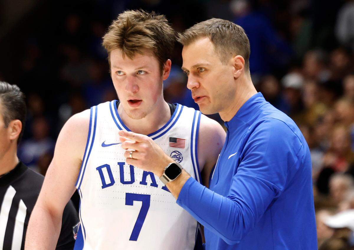 Duke head coach Jon Scheyer talks with Kon Knueppel (7) during the second half of Duke’s 106-70 victory over Stanford at Cameron Indoor Stadium in Durham, N.C., Saturday, Feb. 15, 2025.