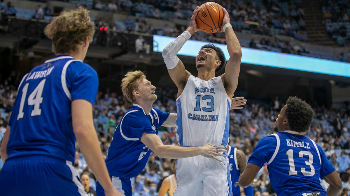 North Carolina’s Dawson Garcia (13) muscles his way to the basket through the UNC-Asheville defense during the first half on Tuesday, November 23, 2021 at the Smith Center in Chapel Hill, N.C.