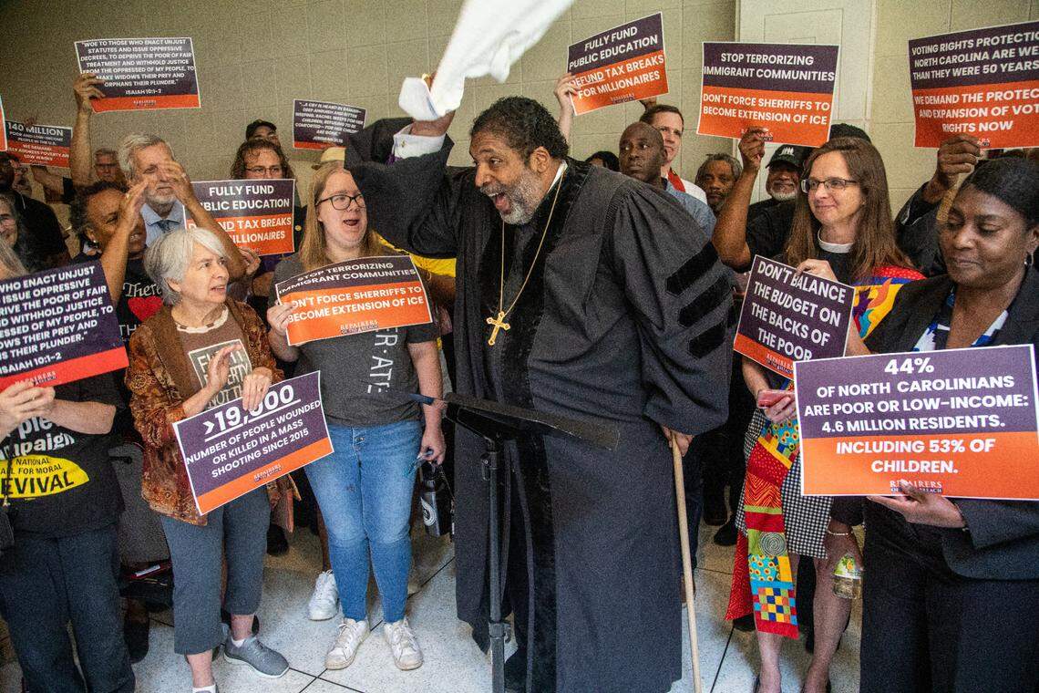 Rev. William Barber II leads a rally of more than 100 demonstrators between entrances to the House and Senate chambers at the Legislative Building in Raleigh Wednesday, May 24, 2023. The protesters called for the Republican-led legislature to amend its budget proposals.